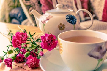Tea and flowers on the table 