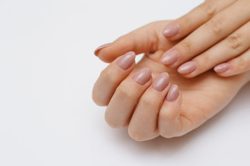 Clean woman hands with manicure close-up. Dermatology and hands care concept.