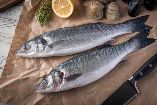 fresh branzini, european sea bass,  with clam and mussle