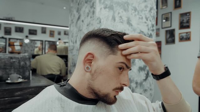 Cline shows the barber editing a haircut. Unhappy customer. 