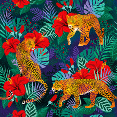 Leopards. Tropical leaves