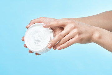 hand with cream on white background