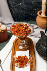 sweet grapes  jam and kettle on the table