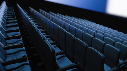 Fototapeta premium Empty cinema hall during the premiere. Rows of armchairs