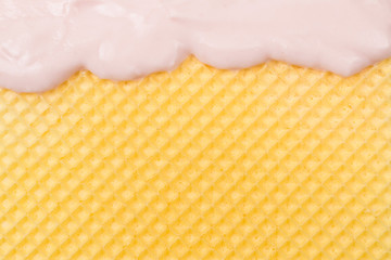 Sweet waffle background with cream.