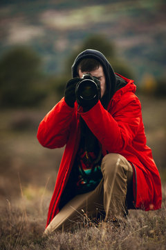 Close up shot of photographer taking photos in nature