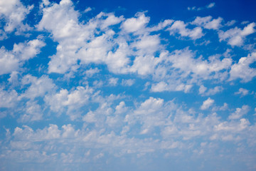 Cloudscape of white clouds and blue sky
