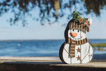 Christmas in Florida concept, snowman craft on the shores of Lake Louisa in Clermont, Florida.