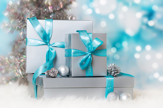 Silver christmas gifts on blue background