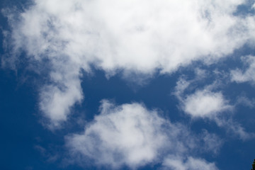 Fototapeta premium Puffy white cloudscape with gap in center