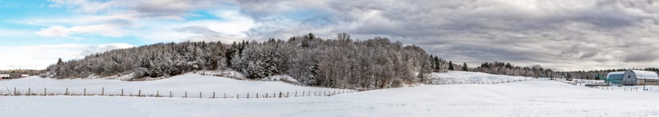 Fototapeta na wymiar Panoramic view of a winter scene in Laurentides area Quebec