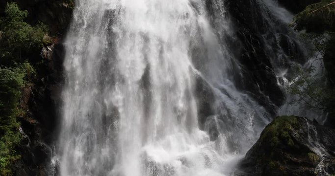 Tilt down shot of the Schleierfall (veil fall), a huge waterfall in the Hohe Tauern nature reserve in the Austrian Alps in the valley of Kals am Gro&szlig;glockner.