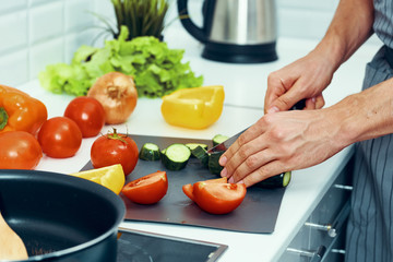 woman cutting vegetables in the kitchen
