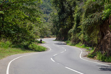 Fototapeta premium Winding mountain road. Serpentine road in the mountains. Dangerous area on the road in the mountains