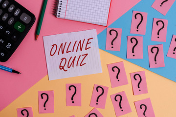 Word writing text Online Quiz. Business photo showcasing game or a mind sport that are published on the Internet Mathematics stuff and writing equipment above pastel colours background