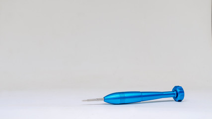 Blue hour screwdrivers lie on a white background. Isolated view.