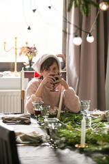 teen girl gets bored at Christmas table