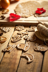 Obraz na płótnie Canvas Dough for Christmas gingerbread and cookie cutters on wooden table