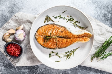 Roasted salmon steak. Healthy seafood. Gray background. Top view