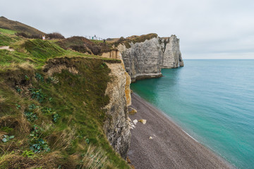 Panoramatic view on Etretat steep rock coastal cliffs at north of France, served as many inspiration for Monet, the impresionist painter