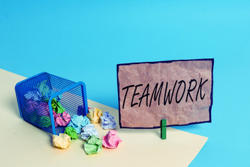 Handwriting text writing Teamwork. Conceptual photo Group of showing who work together as one and with the same aim Trash bin crumpled paper clothespin empty reminder office supplies tipped