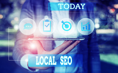 Text sign showing Local Seo. Business photo showcasing This is an effective way of marketing your business online Female human wear formal work suit presenting presentation use smart device