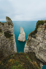 Panoramatic view on Etretat steep rock coastal cliffs at north of France, served as many inspiration for Monet, the impresionist painter