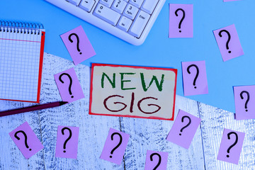 Text sign showing New Gig. Business photo text getting job Attending live Concert Gigabyte Freelancer offer Writing tools, computer stuff and math book sheet on top of wooden table