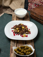 National Azerbaijan meal Qovurma, potato,  pomegranate, olives and meat