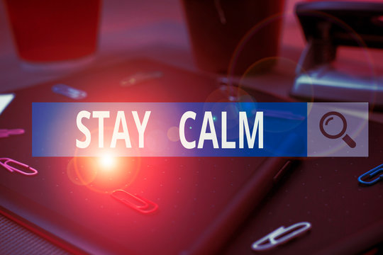 Handwriting text writing Stay Calm. Conceptual photo Maintain in a state of motion smoothly even under pressure Scissors and writing equipments plus math book above textured backdrop