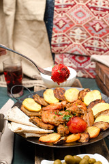 National Azerbaijan meal Sac ichi, potato, olives and meat