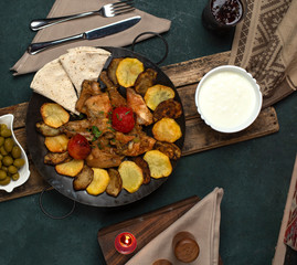 National Azerbaijan meal Sac ichi, potato, olives and meat