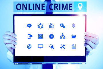 Word writing text Online Crime. Business photo showcasing crime or illegal online activity committed on the Internet Male human holding thick textured cardboard of business promotion concept