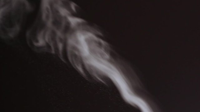 Video of white steam rising from an air cleaner or smoke from a candle. Christmas or winter concept