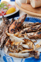 Grilled seafood for lunch at harbourside restaurant Essaouira Morocco