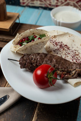 tasty meal Kabab, with tomato, onion and  pomegranate