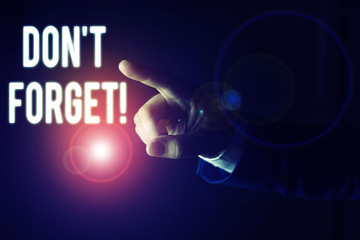Word writing text Don T Forget. Business photo showcasing used to remind someone about important fact or detail Isolated hand pointing with finger. Business concept pointing finger