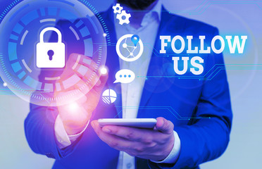 Writing note showing Follow Us. Business concept for Act of demonstrating to invite an individual or group to join his company Male human wear formal suit presenting using smart device