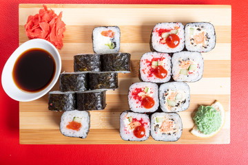 Set of rolls with various fillings, shrimp, salmon and tuna. Close-up.
