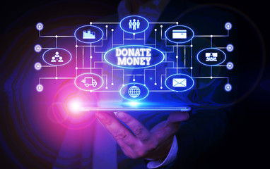 Conceptual hand writing showing Donate Money. Concept meaning to give money or goods to help a demonstrating or organization Male wear formal suit presenting presentation smart device