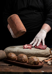 Male chef seasoning filet mignon steaks