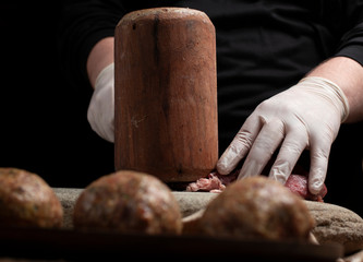 Male chef seasoning filet mignon steaks