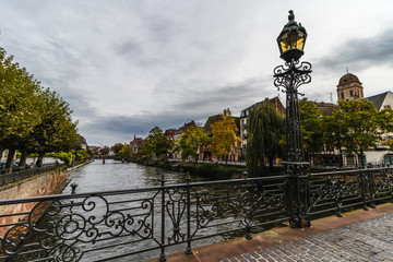 Fototapeta premium River side in Strassbourg, France - typical old houses and bridges in this old historical city
