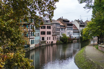 Fototapeta na wymiar River side in Strassbourg, France - typical old houses and bridges in this old historical city