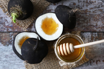 Black radish. Black radish with honey. Natural cure for colds and coughs. Healthy recipes concept....