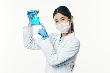 doctor in mask with syringe isolated on white