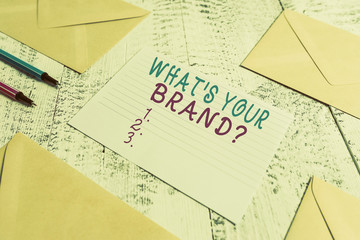 Word writing text What S Your Brand Question. Business photo showcasing asking about product logo does or what you communicate Envelopes highlighters ruled paper sheet wooden retro vintage background
