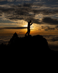 silhouette of man at sunset