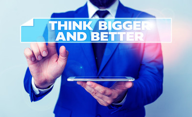 Handwriting text Think Bigger And Better. Conceptual photo no Limits be Open minded Positivity Big Picture Businessman with pointing finger in front of him