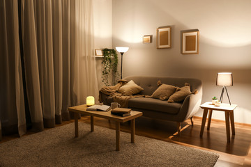 Stylish interior of living room at night
